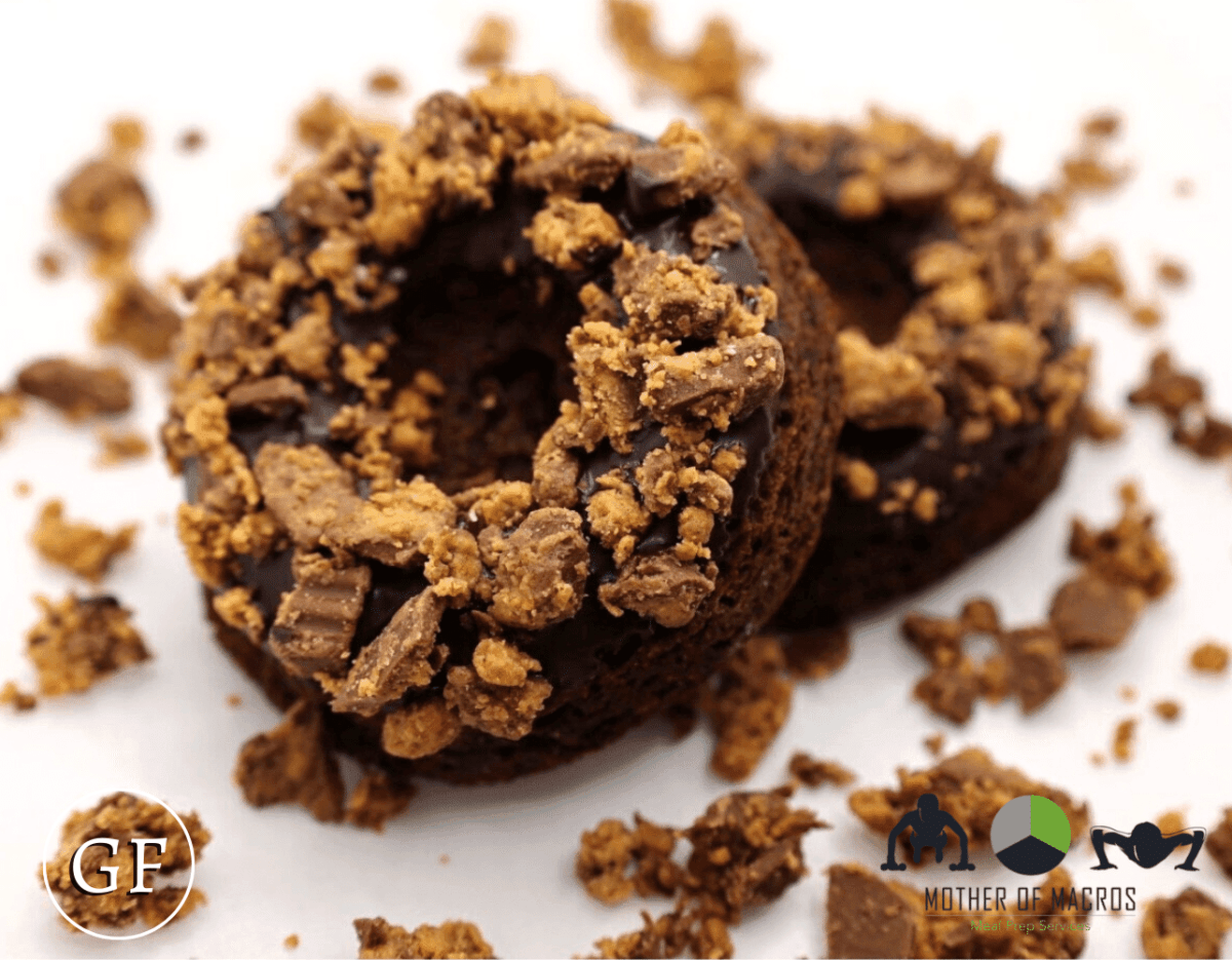 Gluten-free chocolate protein donuts topped with Reese’s peanut butter cup crumbles and dark chocolate